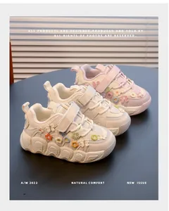 Detailed view of girls' princess sneakers with 3D floral and bow decorations