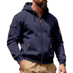 Detail view of navy blue heavy fleece zip-up hoodie with orange accents and utility pockets