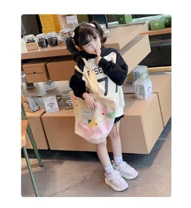 Lifestyle view of stylish girl's sneakers with floral bead accents and soft soles.