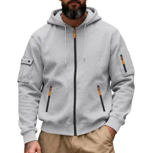 Close-up of heavy grey fleece material and functional orange zipper pocket details