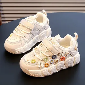 Stylish girls' sneakers with colorful floral accents and soft chunky wavy soles for kids.