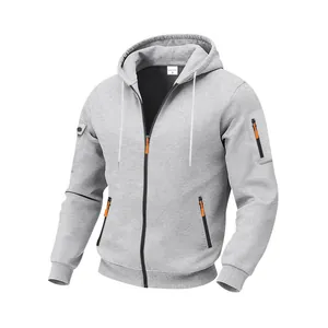 Detailed view of gray heavyweight fleece hoodie with distinctive orange zipper accents.