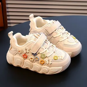 Stylish white sneakers for girls with colorful 3D flower embroidery and chunky soft soles.