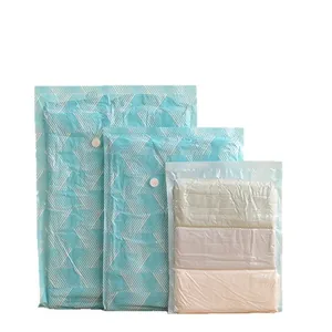 Set of vacuum compression storage bags with blue geometric patterns and transparent window.
