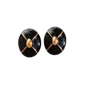 Vintage black enamel oval stud earrings with gold X-pattern accents and 925 silver needles