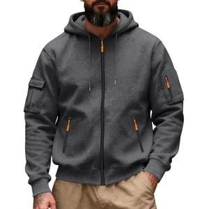 Detail of men's grey heavy fleece hoodie with orange zip pulls and utility pockets