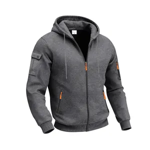 Close-up detail of heavy fleece zip-up hoodie featuring orange zipper pulls and pocket.