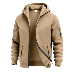 Detail view of khaki heavy fleece hoodie with orange zipper accents and workwear pockets