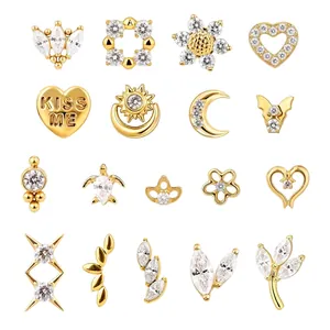 Detailed macro view of multiple F136 titanium 18k gold plated crystal ear studs.