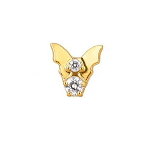 Close-up of F136 titanium butterfly piercing charm with 18k gold plating