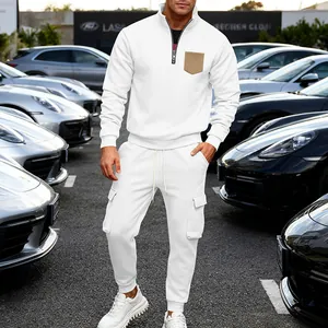 Close-up of white heavy fleece two-piece tracksuit with cargo pants and quarter-zip