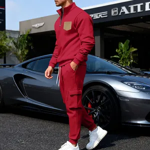 Side view of a red heavyweight fleece tracksuit set with a stand collar and cargo pants.