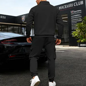 Back view of men's black fleece-lined tracksuit with cargo pants and stand collar.