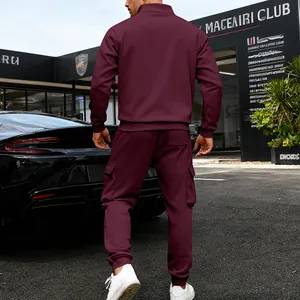Back view of a man wearing a maroon heavy fleece tracksuit with cargo sweatpants