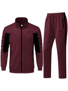Burgundy men's two-piece tracksuit with black color-blocked panels and zip-up jacket.