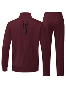 Rear detail view of a burgundy men's two-piece tracksuit featuring geometric back pattern