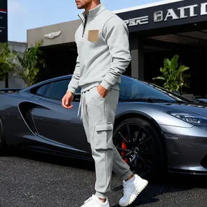 Detailed side view of a grey heavy fleece tracksuit set with a contrast chest pocket.