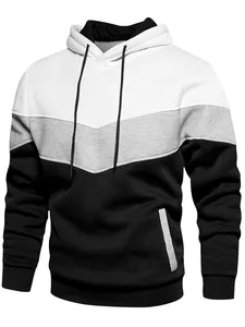 Close-up of a tri-color blocked hooded sweatshirt with drawstring and side pocket detail