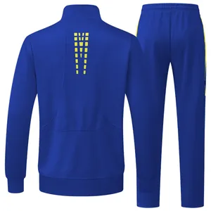Men's royal blue two-piece sport tracksuit set with yellow geometric back pattern