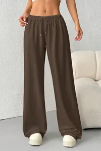 Close-up of brown casual wide-leg sweatpants with drawstring and elastic waist.