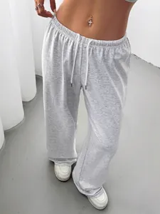 Comfortable light grey wide-leg women's sweatshirt trousers with adjustable drawstring.