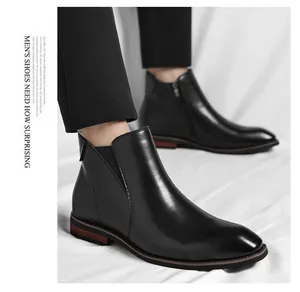 Side view of black leather Chelsea boots for men with side zipper and wood-accent sole