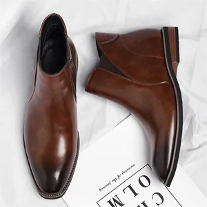 Classic brown leather Chelsea boots for men with side zipper and dark polished toe detail