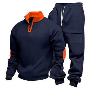 Men's heavyweight fleece tracksuit set in navy blue with orange stand collar details.