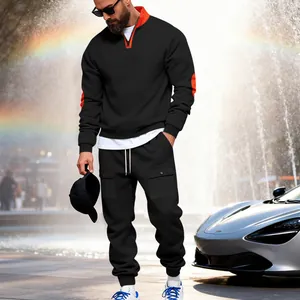 Detailed view of men's black fleece tracksuit set featuring orange collar accent