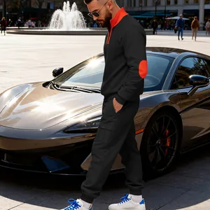 Men's heavyweight black fleece tracksuit set with orange stand collar and elbow details