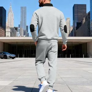 Back view of premium men's gray fleece tracksuit featuring stand collar and black elbow patches