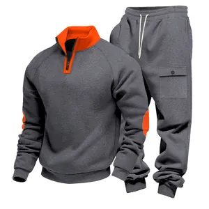 Detail of men's heavyweight fleece grey tracksuit with orange accents and cargo pockets
