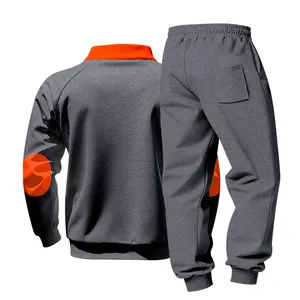 Close-up detail of men's heavy fleece grey tracksuit featuring orange stand collar
