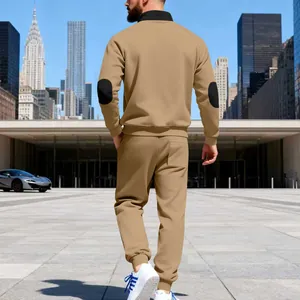 Back view of men's khaki fleece tracksuit with black elbow patches and stand collar.