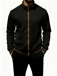 Close-up detail of men's black quilted zip-up jacket featuring stylish brown contrast trim