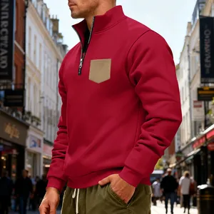 Men's red heavy fleece sweatshirt featuring half-zip collar and contrast pocket