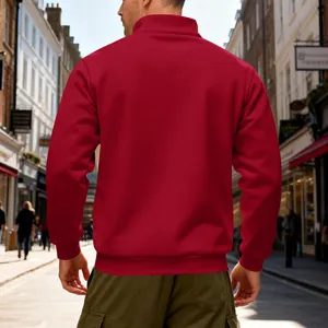 Back view of men's heavy red fleece sweatshirt with stand collar in urban street setting