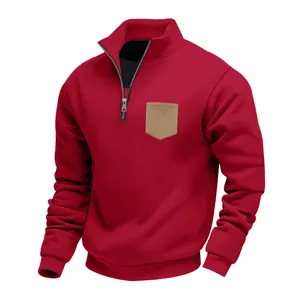 Close-up view of a heavy red men's fleece sweatshirt with quarter-zip and brown pocket