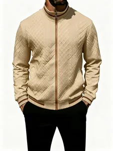 Detail view of beige quilted men's bomber jacket with ribbed striped trim and zip closure.