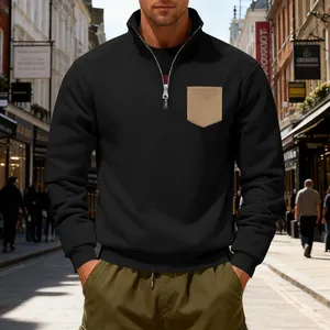 Detailed view of men's heavyweight black fleece sweatshirt with khaki chest pocket