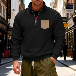 Mens heavyweight black quarter-zip sweatshirt featuring a stylish khaki contrast pocket