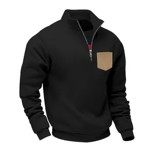 Close-up of black heavy fleece men's sweatshirt with half zipper and khaki chest pocket