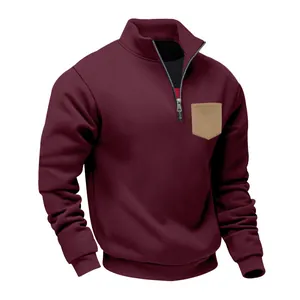 Detail of men's quarter-zip heavy fleece sweatshirt in burgundy with khaki chest pocket