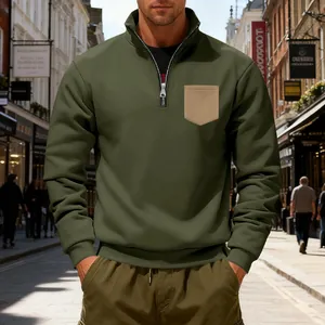 Men's olive green quarter-zip sweatshirt with a contrasting khaki chest pocket
