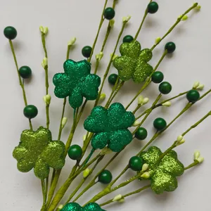 Detail view of vibrant glittery green shamrock stems for St. Patrick's Day decorations.