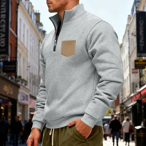 Grey heavyweight fleece quarter-zip sweatshirt with a contrasting tan chest pocket.