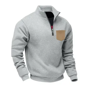 Detail view of grey heavy fleece sweatshirt with khaki chest pocket and quarter zipper