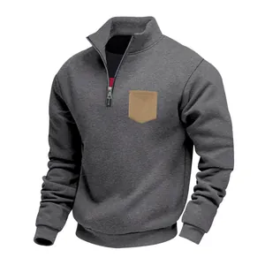 Detailed view of heavy fleece sweatshirt with stand collar and tan chest pocket accent