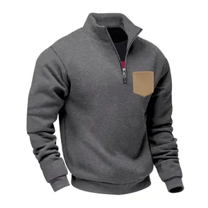 Detail view of heavyweight grey sweatshirt with half-zip stand collar and contrast pocket
