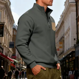 Men's heavy fleece quarter-zip sweatshirt with a contrast chest pocket in an urban setting